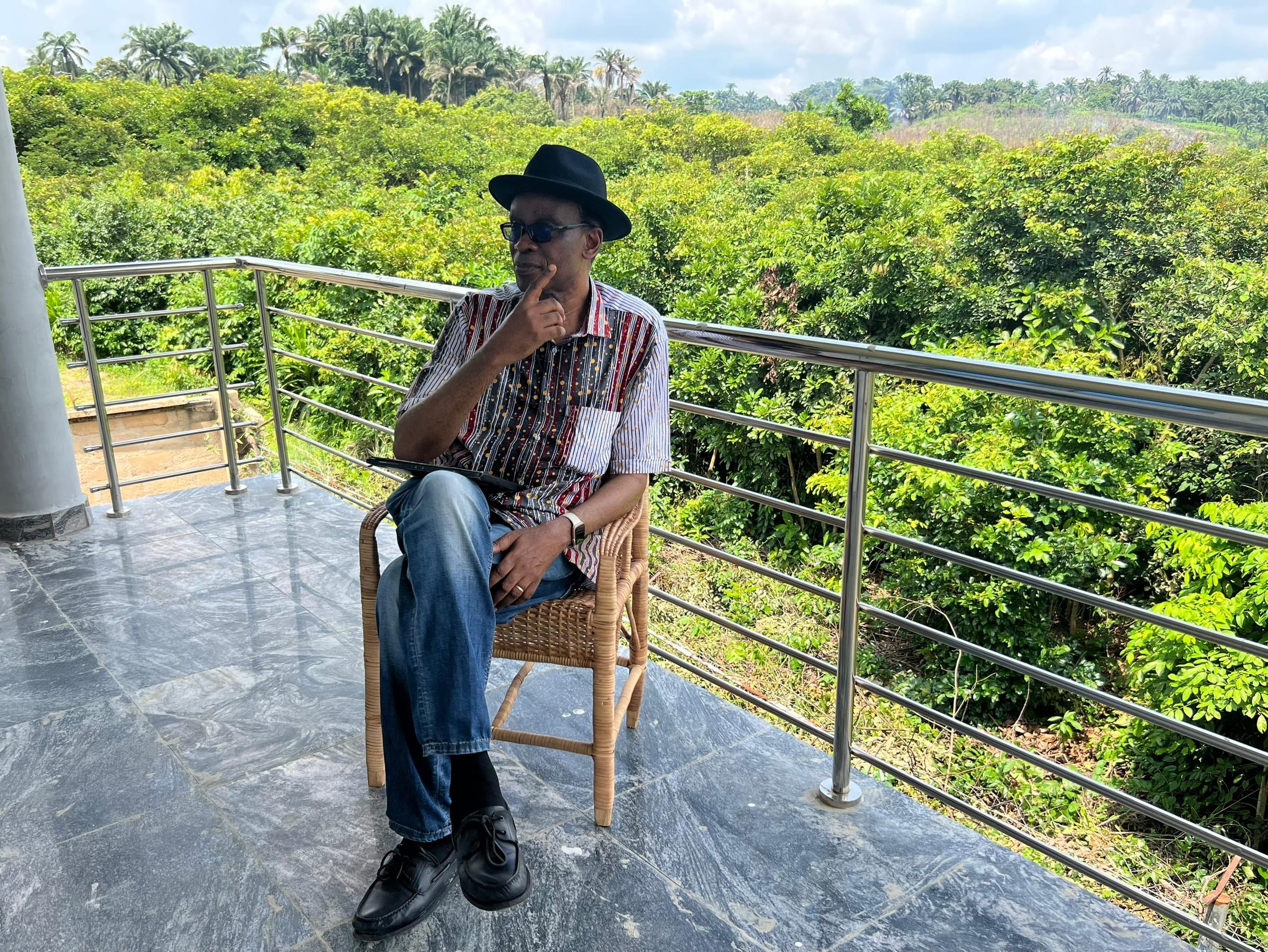 A chair on the balcony, looking over the valley